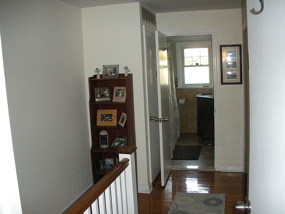 2nd floor hall, has pull down access to attic with large storage space.