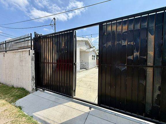 Private courtyard/parking area behind gate