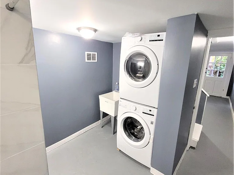 Laundry area in the full bath in basement