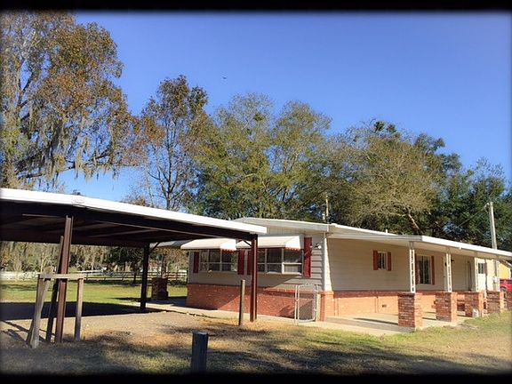 Back of Home w/carport