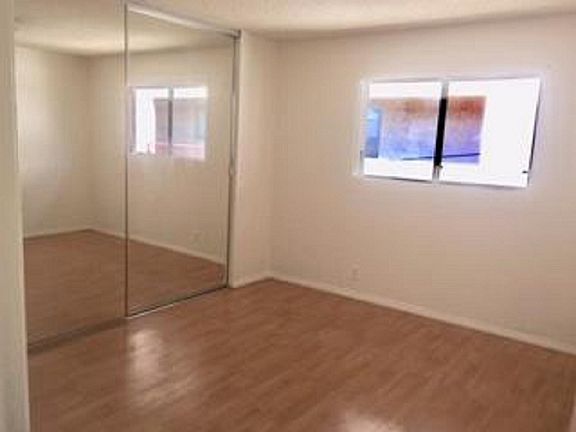 Master Bedroom has floor-to-ceiling mirror closet doors and an adjoining bathroom