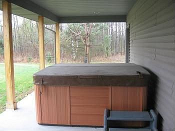 Hot tub included ....underneath the covered patio