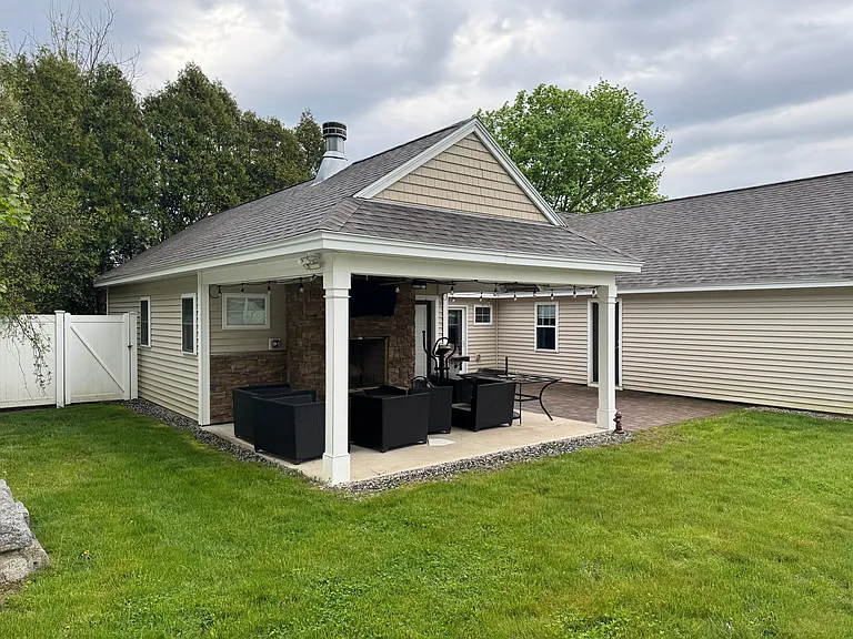Covered cabana inside fenced yard