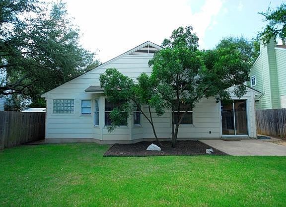 Backyard has water wise Zoysia sod and a nice flat lot for garden, playground, pool??