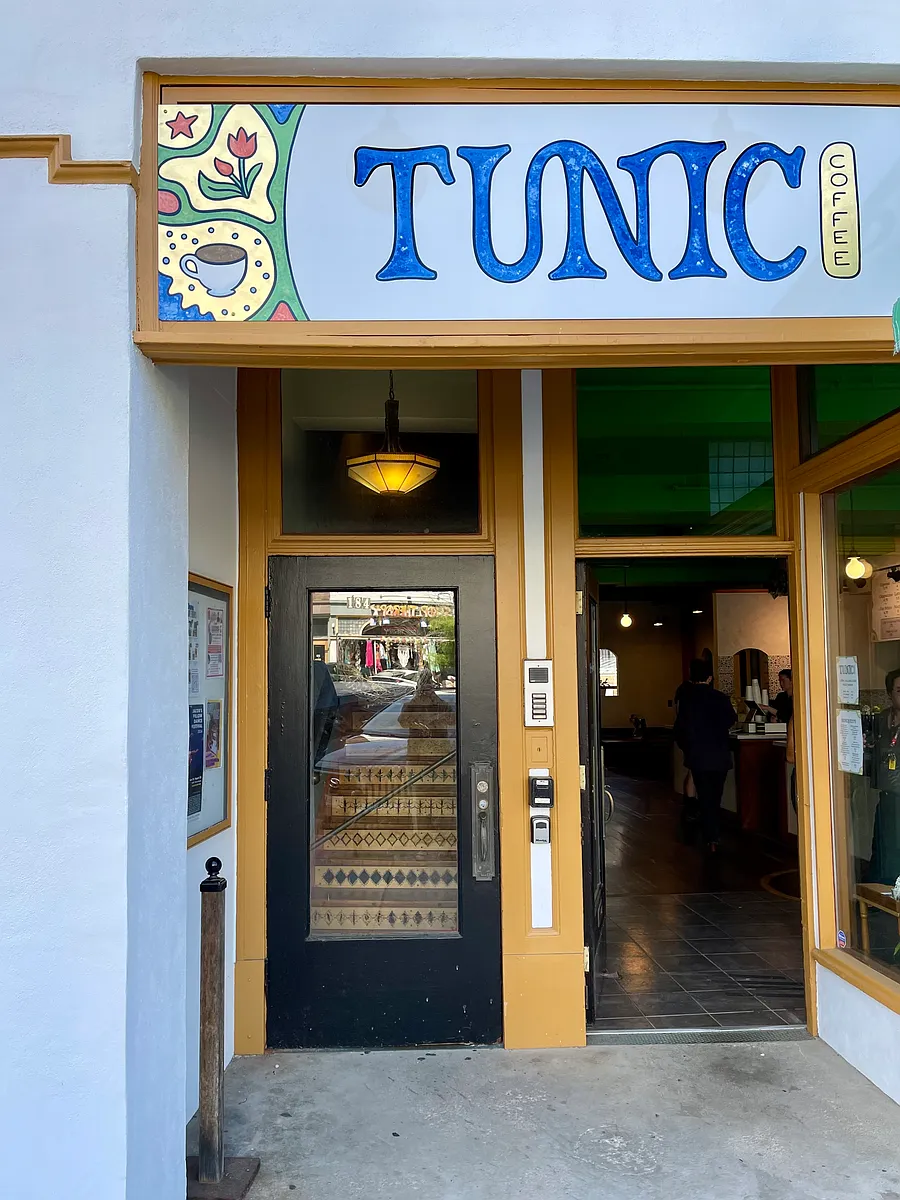 The door to the building is next to Tunic's front door. - 184 Main St #2F