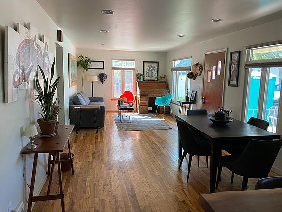 View of dining room and living room from kitchen.