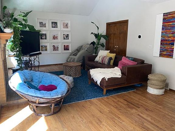 living room with newly installed gas fire place that easily turns on and off with a switch