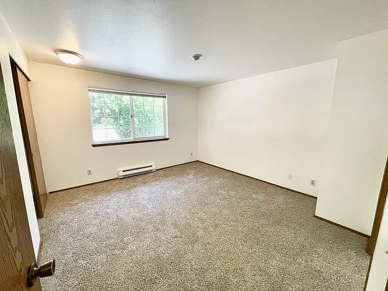 Front Bedroom with full-size wall closet and separate access to bathroom.