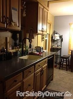 Kitchen
						:
						New Kitchen with Hickory Cabinets, Corian Countertop, Built-in sink & new floors