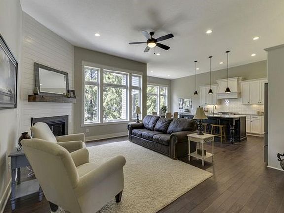 Open great room with gas-burning fireplace.