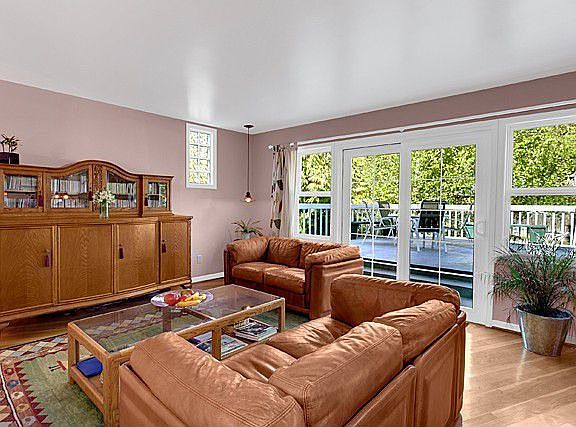 Large family room off kitchen opens to entertainment sized deck.