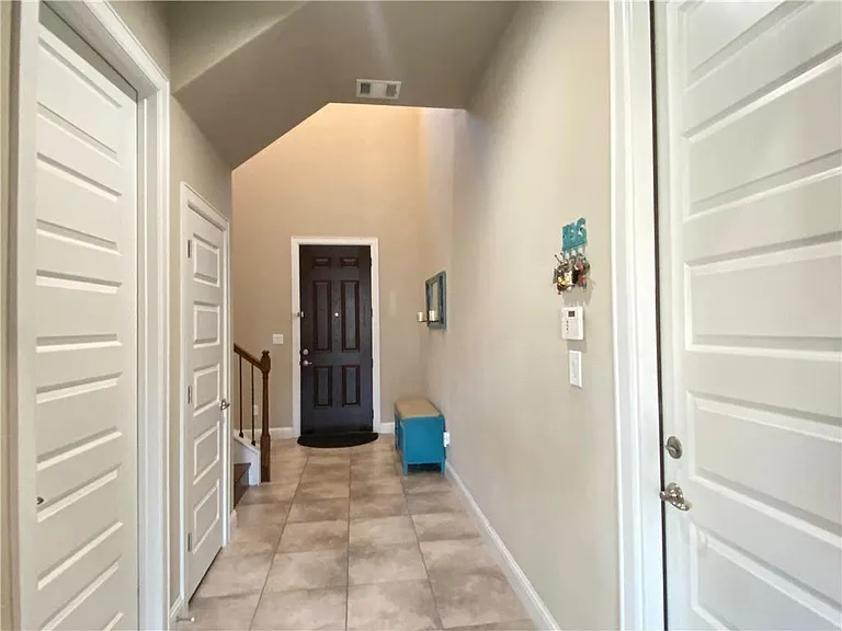 Entryway, Powder bath and Garage Entry and Coat room with storage