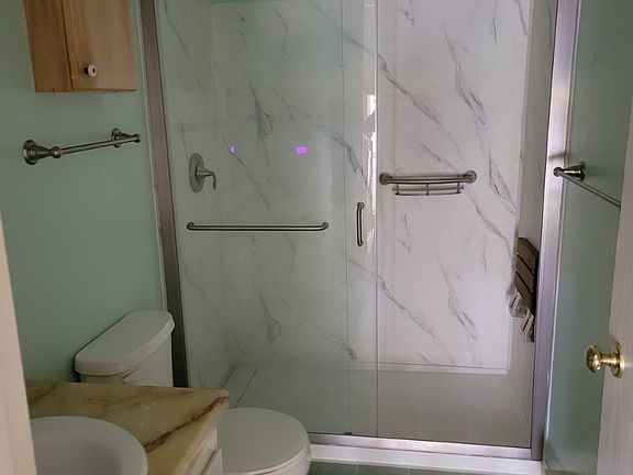 full bath with seat in shower