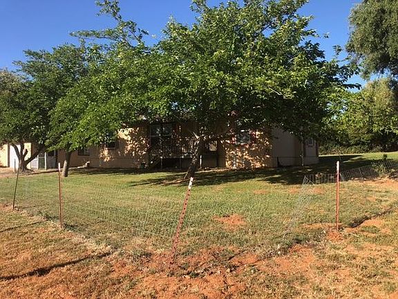 Front yard with Large Shade Trees for those HOT summers