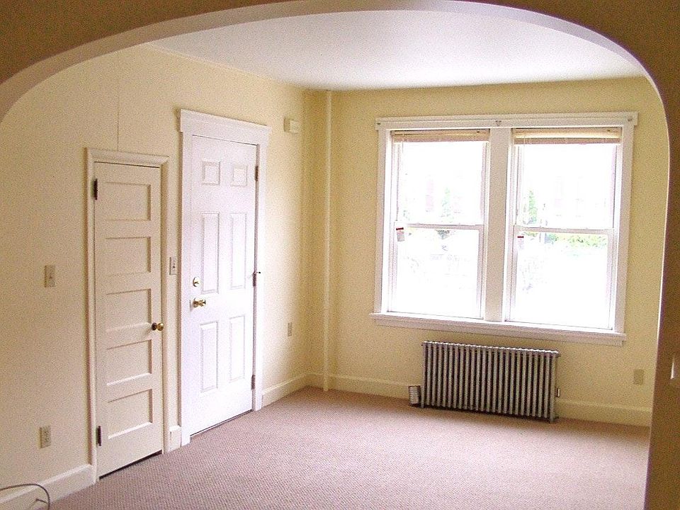 Living Room Showing Walk-in Closet and Front Entrance to Hallway
