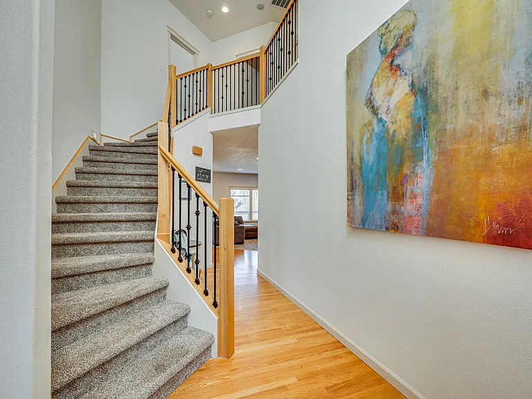 Straight ahead for the kitchen, living room, or office, left for the sitting room or secondary dining area, upstairs for the bedrooms
