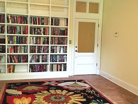 Large foyer with tons of built-in bookcases!
