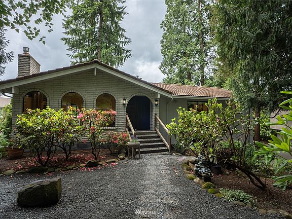 Front of the home features arched windows and matching entryway