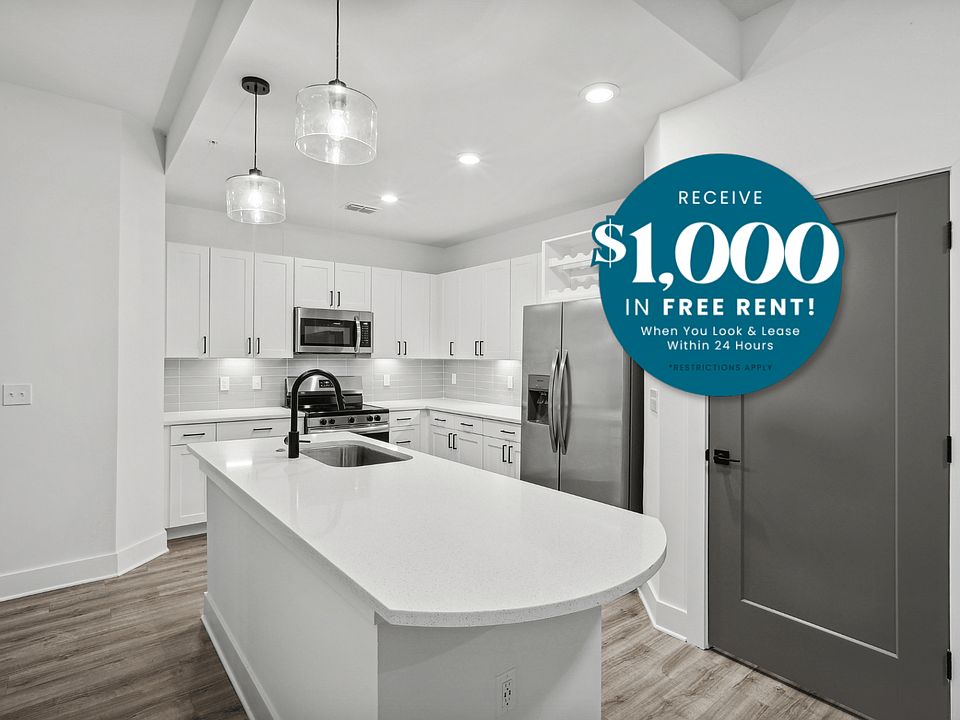 Kitchen with Quartz Countertop and Stainless Steel Appliances.
