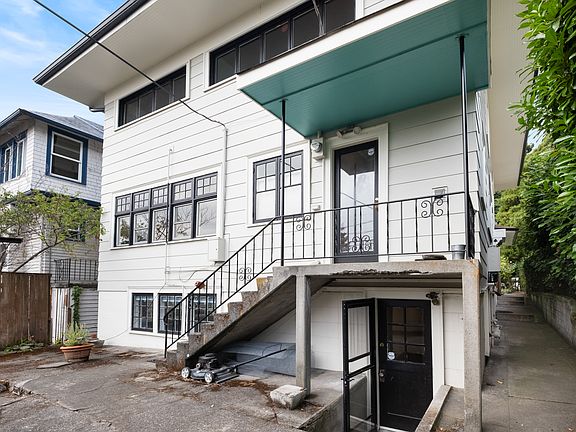 Back patio and rear entrance to basement apartment