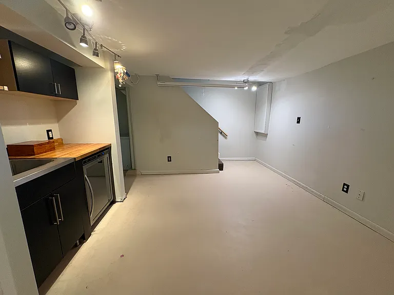 Bonus 408 Sq. Ft. Basement space with Bar fridge and sink.