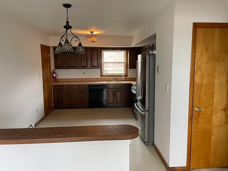 Kitchen area with room for an table/chairs. Closet that can be used as wardrobe or pantry. 1st entry to apartment shown on left.