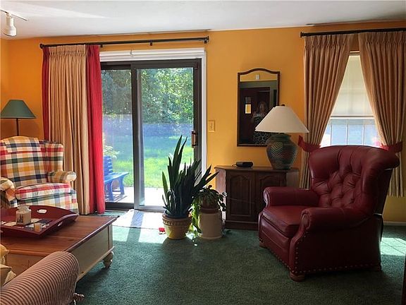 Sunny Living room with window treatments!
