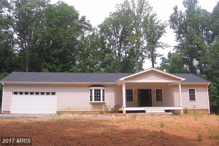 Front view with two car garage