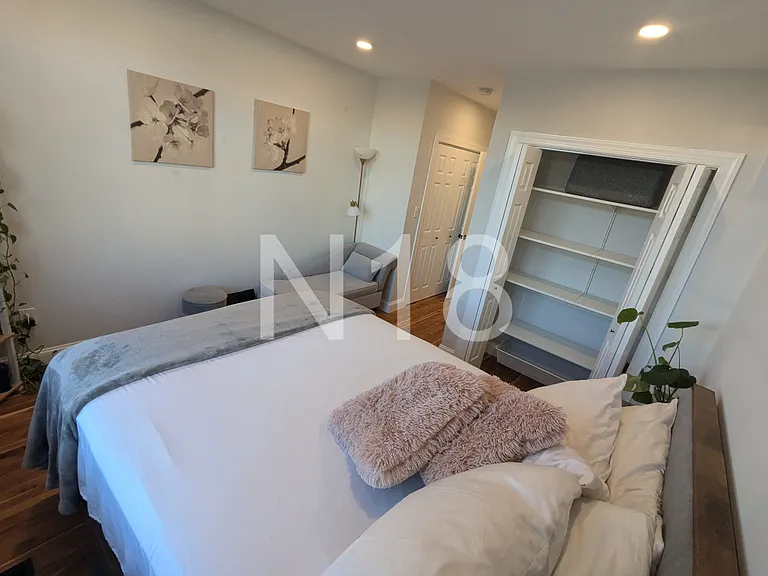 Primary bedroom with en suite bathroom and two closets
