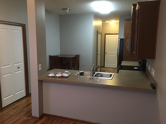Storage closet under steps on left