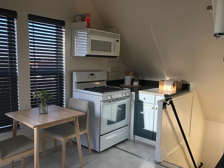 Charming, spacious kitchen layout featuring a gas stove and plenty of room to set up a dedicated eating table