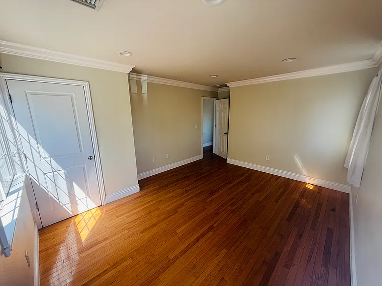first bedroom. walk in closet. Three windows. Corner room