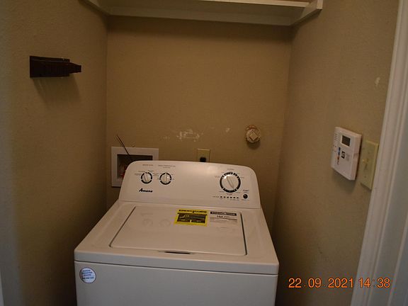 Laundry room inside the house. Washer and dryer included.
