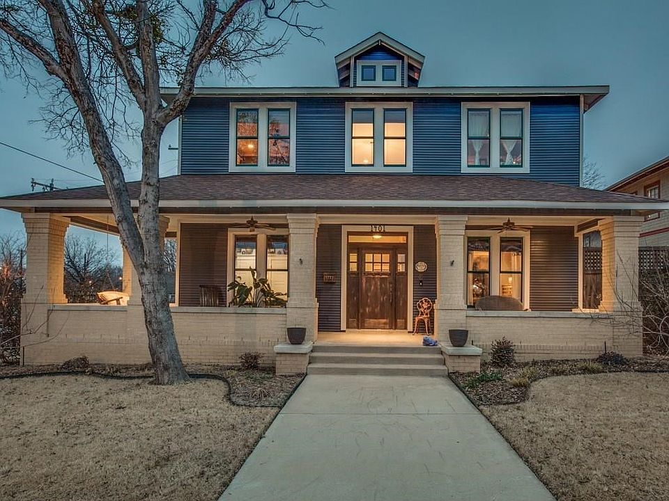 Beautiful large front porch with swing and built-in speakers enhance the drive up appeal on this beautiful custom built home in Fairmount Historical District