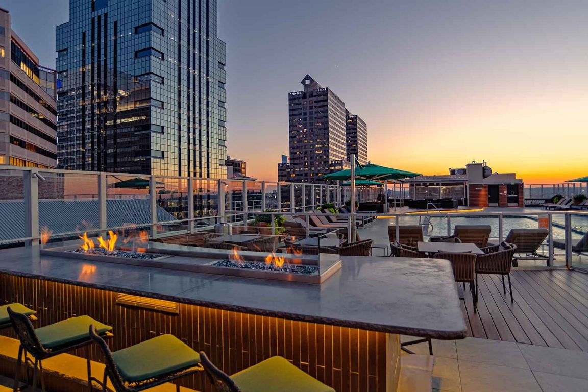 Warm up on breezy nights at the poolside fireplace lounge