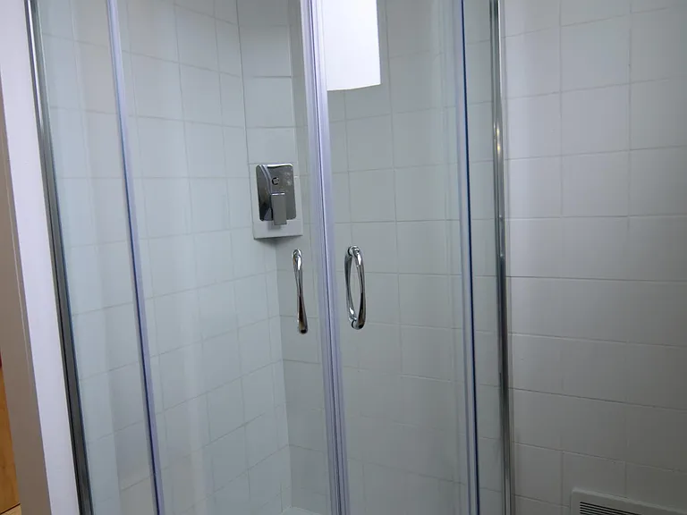 Newer bath with tile floor, shower.