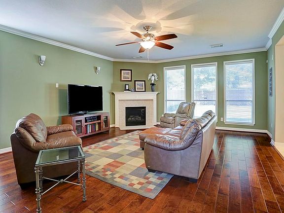 Family room features upgraded hardwood flooring and an abundance of light.