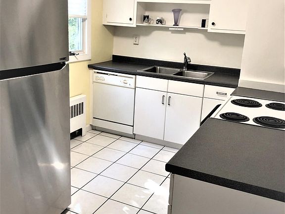 Kitchen, new refrigerator, dishwasher, electric stove all in good working condition. Counter space , window looking out the back yard