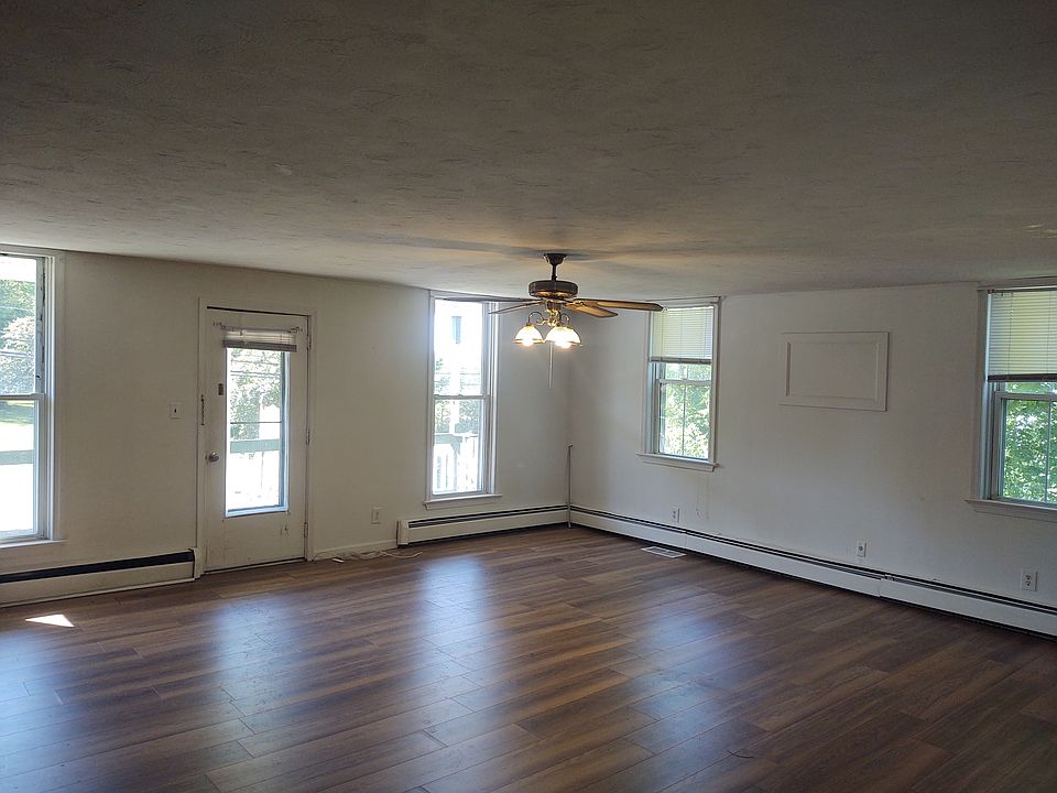Tons of windows in this huge living room.