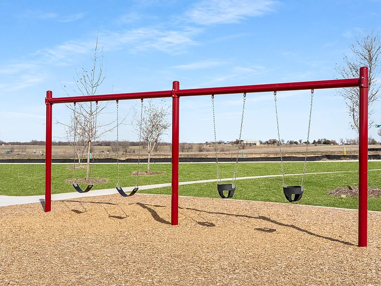The swing set includes swings for kids of all ages.