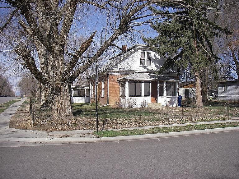 Front of house with screened porch