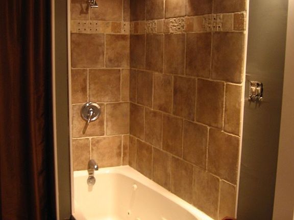 Tiled shower with jacuzzi