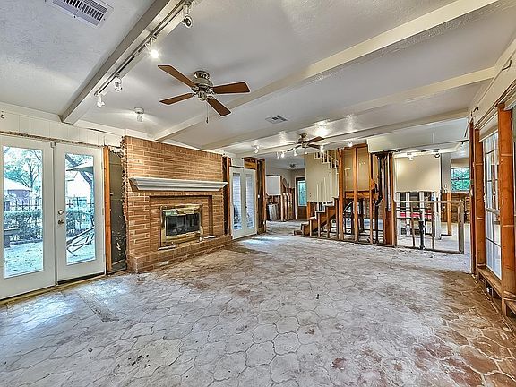 Additional view of family room showcasing double French doors to front patio.