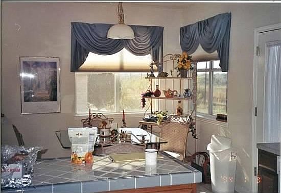 Open kitchen plan with breakfast nook.