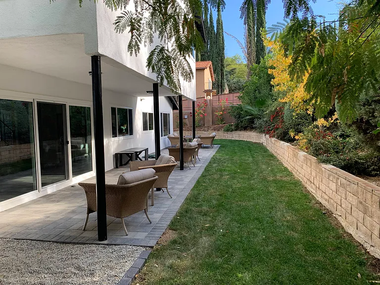 backyard with large covered patio and patio furniture