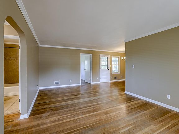 Looking in from the front door. 2beds and 1 bath to the left, 3rd bed straight ahead, dinning/kitchen combo to the right.
