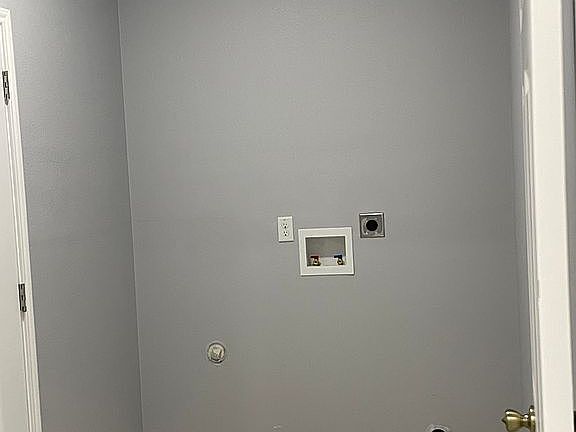 Laundry room by 2 car garage