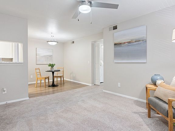 Enjoy the seamless flow of this open-concept living and dining area, perfect for relaxing or entertaining guests.