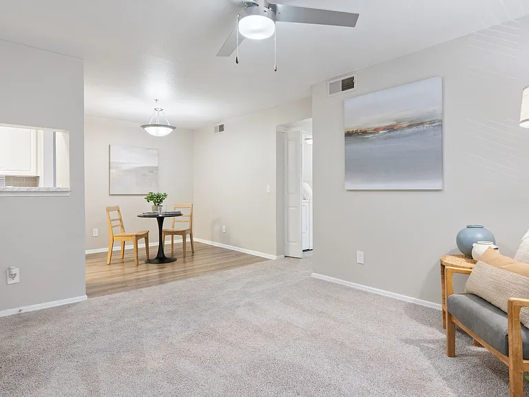 Enjoy the seamless flow of this open-concept living and dining area, perfect for relaxing or entertaining guests.