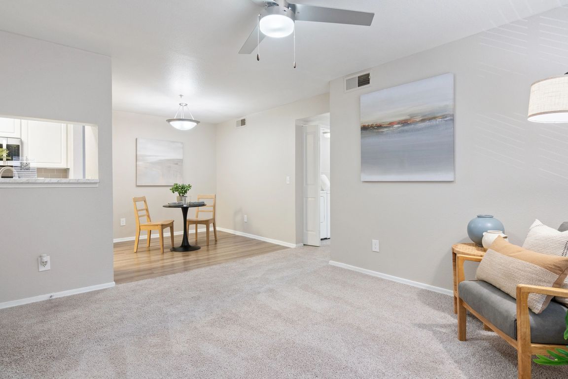 Enjoy the seamless flow of this open-concept living and dining area, perfect for relaxing or entertaining guests.